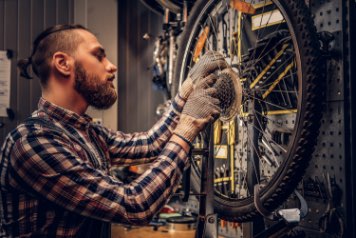 man repairing a bike